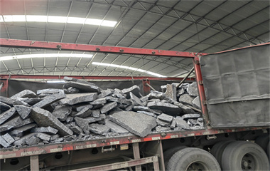 Ordered ferrosilicon is loaded onto trucks for transportation